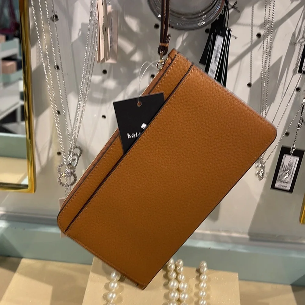 Kate Spade Medium Lucy L-Zip Wristlet Pebble Leather 

Warm Gingerbread 
NWT - Picture 13 of 16
